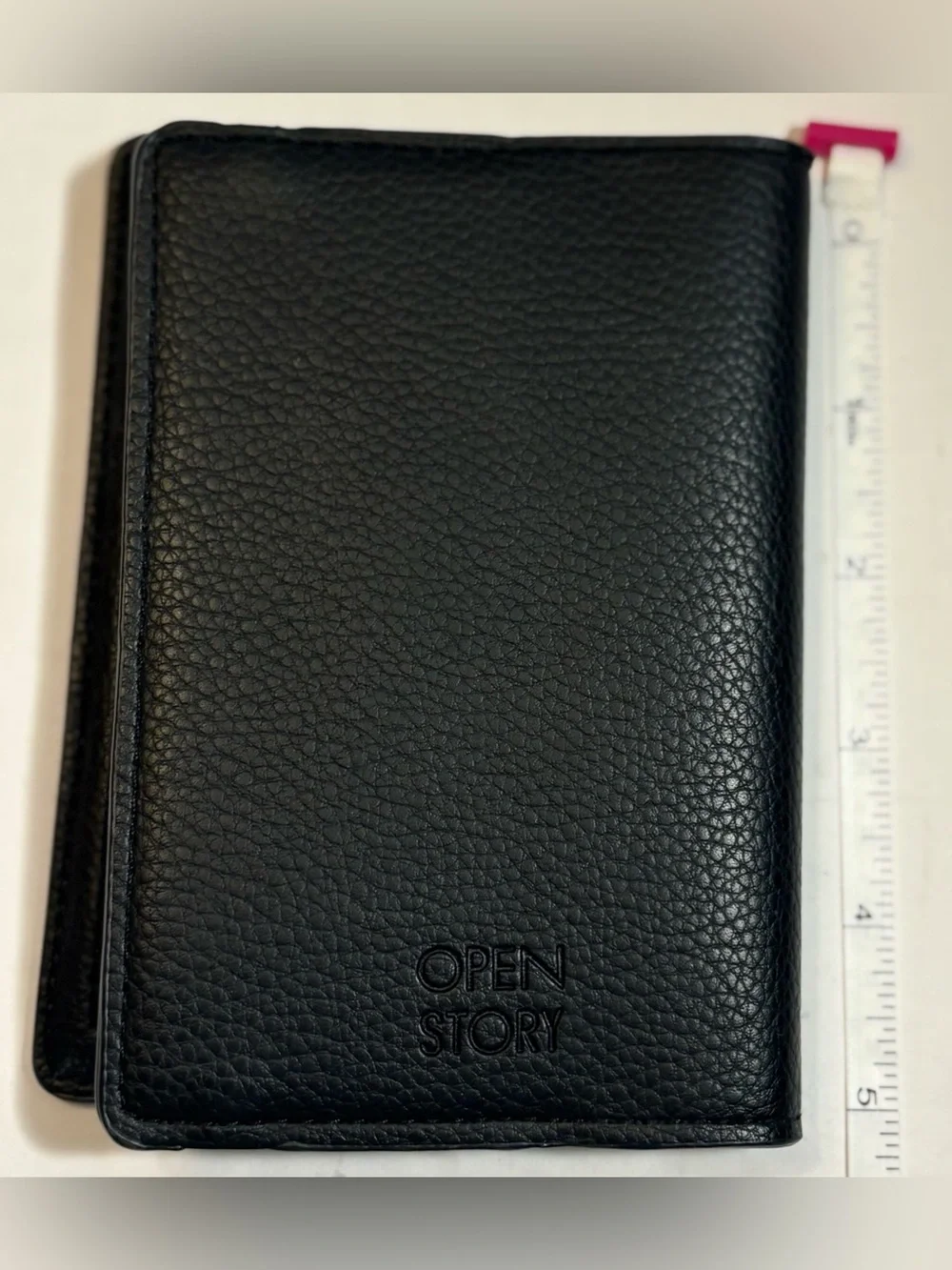 Open Story black pebble leather passport holder or travel wallet